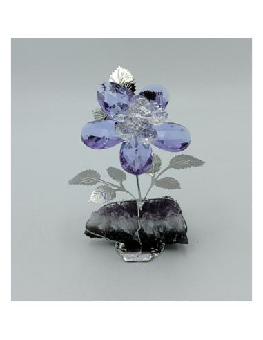 Flor de vidro violeta com base de pedra