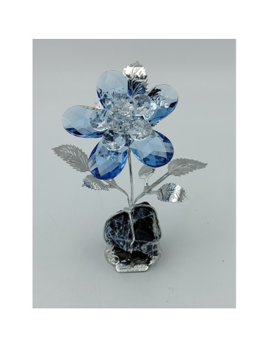 Flor de vidro azul com base de pedra