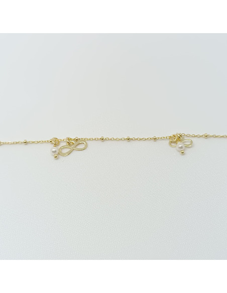 Pulseira  pérolas e símbolos